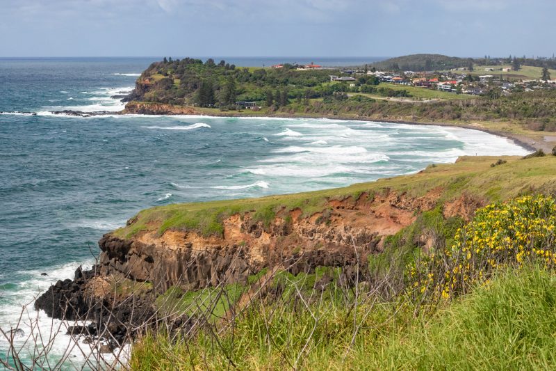 Lennox head south from Byron Bay. Bay and cliffs, where surfers enjoy the waves. Lennox Head, New South Wales NSW